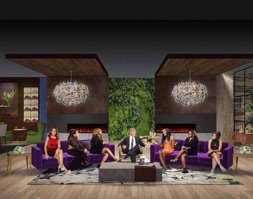 Midcentury modern living room furniture for Real Housewives reality TV show set designed by Nino Madia, luxury furniture store. Features 2 matching purple couches.