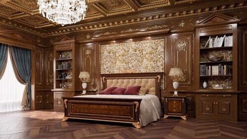 luxury Italian king bedroom furniture set from Nino Madia with matching nightstands and gilded decorative accents that complements the custom woodwork in the master bedroom