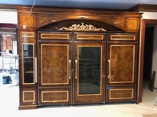 integrated refrigerator and freezer to match custom kitchen cabinets. hidden fridge and wood cabinetry design by Nino Madia.