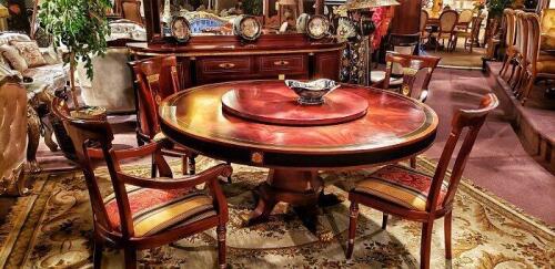 high end round wood art nouveau dining room table with built in lazy susan and 4 open backed chairs with striped fabric seats. Floor samples for sale.