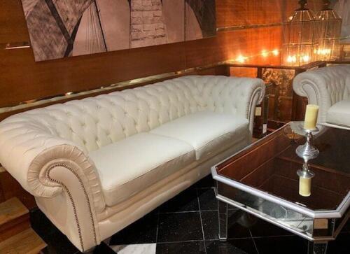 Tufted white leather chesterfield sofa and armchair. Floor samples for sale.