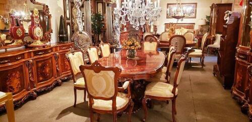 ornate carved wood dining table set with 8 dining room chairs. Floor samples for sale.